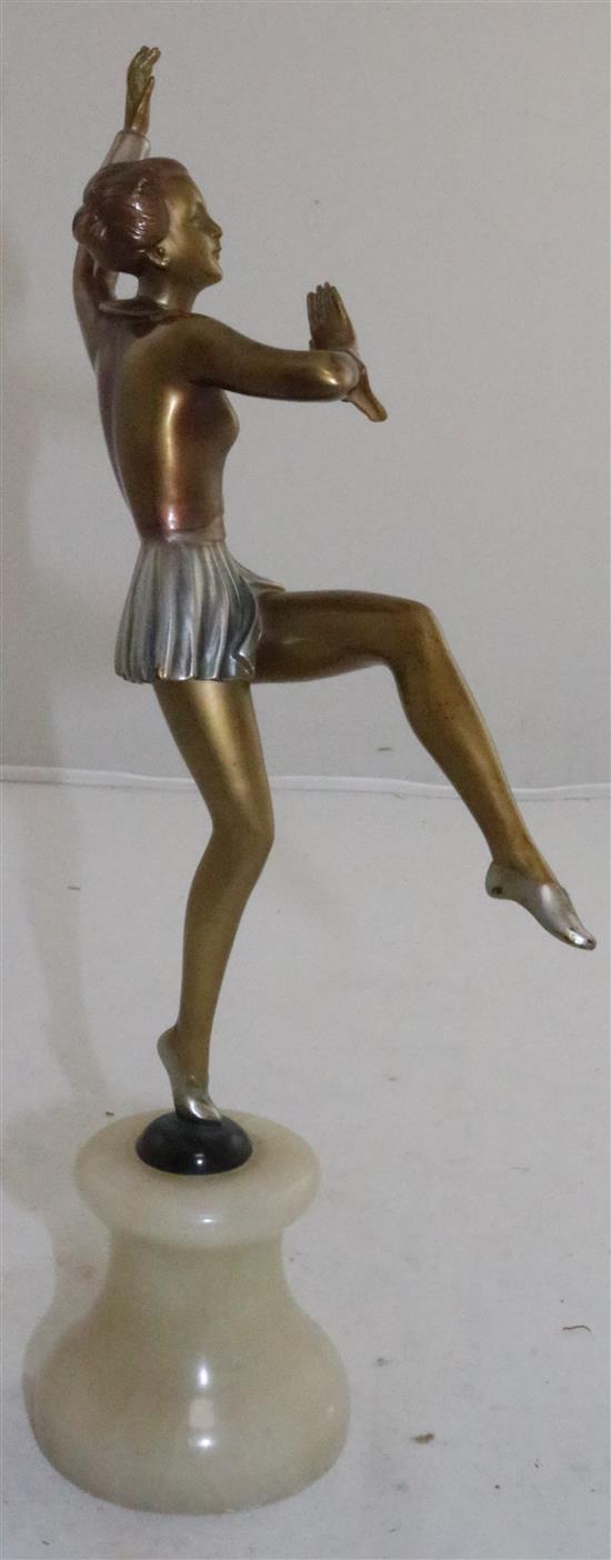 A Lorenzl style patinated bronzed metal possibly spelter figure of a dancing girl, 12in.